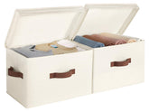 StorageWorks fabric storage bins with lid in ivory on a shelf for tidy storage.
