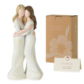 Storieme Sister Embrace Figurine closeup shows hand-painted details for a heartfelt keepsake