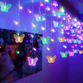 SunKite butterfly curtain lights illuminate windows with colorful butterflies for cozy room ambiance.