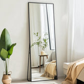 Sunniry full-length mirror on floor with black aluminum frame for modern spaces.