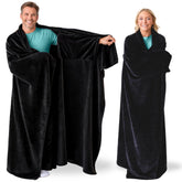 Super Blanky wearable blanket in dark black with pocket sleeves for cozy lounging at home.
