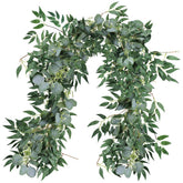 Supla mixed eucalyptus willow garland on arch for rustic wedding backdrop.