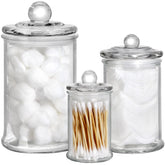 Suwimut glass apothecary jar for cotton swabs keeps vanity organized and clean.