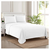 Sweet Home Collection king-size sheets on bed with crisp white finish for cozy, cool nights.
