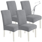 SYSLOON waterproof chair covers in light gray protect dining chairs from spills and stains.