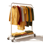 Sywhitta clothing rack with hanging rod and wheels for mobile wardrobe organization.