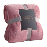 TASTHROW large pink flannel blanket on sofa for cozy lounging