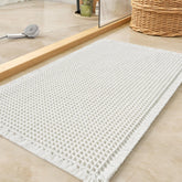 Tchdio waffle bath mat with absorbent surface for quick water pickup.