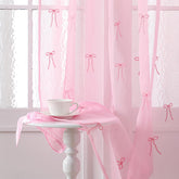 Tegeme 2-panel pink bow sheer curtains filter light softly for 84-inch windows.