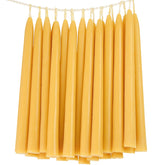 TELOSMA 24-pack beeswax taper candles in a yellow box for bulk gifting.