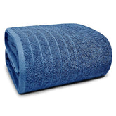 Tens Towels jumbo bath sheet in blue flatlay highlighting its 40 x 80 inch size for wrapping