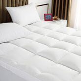 TESIONE Queen mattress topper close-up of spiral fiber filling for plush comfort.