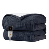 Texciting heated blanket with soft fleece fabric for cozy warmth on bed or couch.