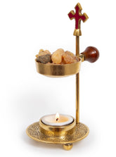The Jerusalem Gift Shop gold cross incense burner adds reverent ambiance to prayer corners.
