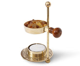 The Jerusalem Gift Shop resin incense burner designed for tea-light use enhances ambience.