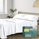 THREAD SPREAD percale sheets on bed show crisp, cooling comfort.
