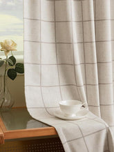 Three Girls pinch-pleated blackout curtains block light for living rooms and media spaces.