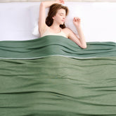 Topcee cooling blanket on a bed setup showing cool, breathable comfort for hot sleepers.