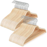 TOPIA HANGER sleek wooden hanger with non-slip shoulders keeps dresses secure.