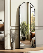 Trahome arched full-length mirror with aluminum frame boosts light and style.