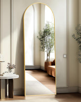 TRAHOME arched mirror front view in gold adds brightness and style.