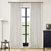 TWODRAPES natural linen blackout curtains with pinch pleats provide private darkness and energy savings.