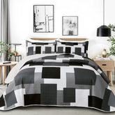 Tyrot patchwork quilt king coverlet in black gray for bold bedroom styling.