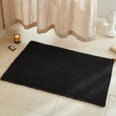 TYUU black waffle bath rug close-up showing textured surface for comfort.