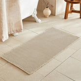 TYUU Pale Beige Bath Rug with waffle texture for plush post-shower comfort.