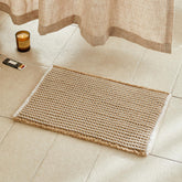 TYUU waffle bath mat in khaki and white offering soft comfort by the sink