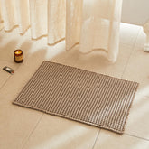 TYUU waffle bath mat in beige with plush texture and 30x20 size for cozy comfort.