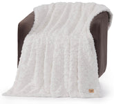 UGG Adalee faux fur throw blanket shows wave texture for luxurious couch styling.