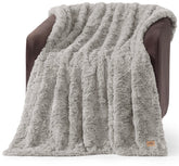 UGG Adalee wave texture throw on a couch for cozy, lightweight warmth.