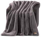 UGG Euphoria throw front plush fur texture adds luxurious warmth to seating.