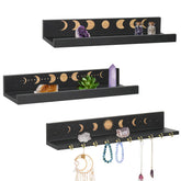 Ukonvi crystal shelf with moon hooks displays jewelry and crystals.