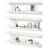 Upsimples floating shelves on a living room wall forming a long, stylish display.