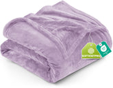 Utopia Bedding fleece blanket in lilac draped over a queen bed for cozy warmth.