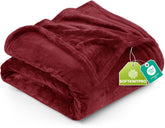 Utopia Bedding fleece blanket on a bed in burgundy adds luxurious warmth