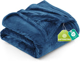 Utopia Bedding fleece blanket in royal blue draped on a bed for cozy warmth.