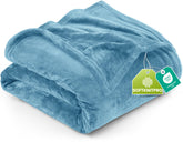 Utopia Bedding fleece blanket in washed blue on bed offers cozy warmth and luxury