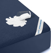 Utopia Bedding king mattress protector full coverage on a king bed for dry, clean sleep.