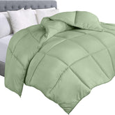 Utopia Bedding queen comforter in sage green fabric showing soft fluffy feel for year-round comfort.