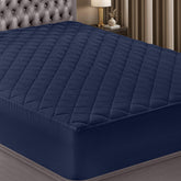 Utopia Bedding quilted fitted mattress pad in navy adds soft loft for comfy sleep