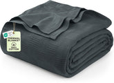 Utopia Bedding thermal blanket smoke gray draped on couch for cozy evenings.