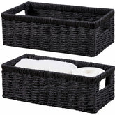 Vagusicc wicker storage basket with handles on a bathroom shelf for easy access.