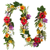 Valery Madelyn 6ft spring garland on the mantel with daisies and butterflies, warm glow.