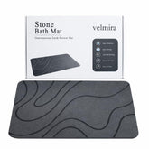 Velmira Stone Bath Mat with porous surface for fast water absorption.