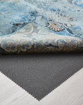 Veken rug pad gripper on hardwood floor keeps rugs securely in place.