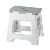 Vigar compact step stool folded, ideal space-saving storage beside cabinets.