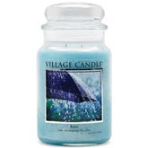Village Candle Rain large blue glass apothecary jar delivers a fresh ambience for living rooms.